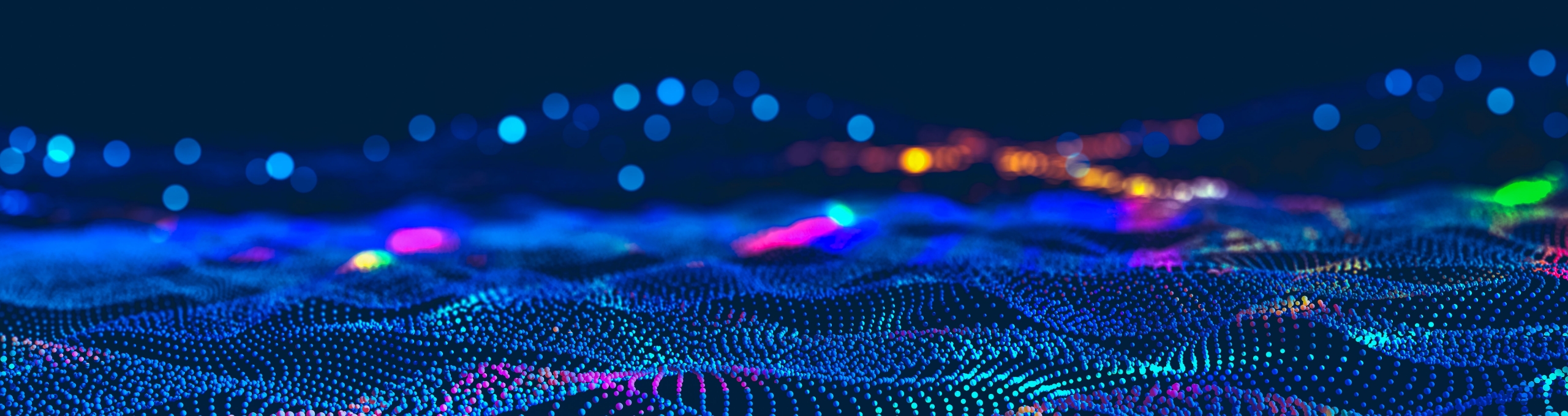 Image of an abstract background with dynamic lights and waves, signifying the innovation in digital model development.
